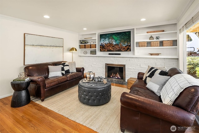 10261 NE 21st Pl, Bellevue, WA 98004 - living room with wood finished floors, ornamental molding, recessed lighting, and a fireplace