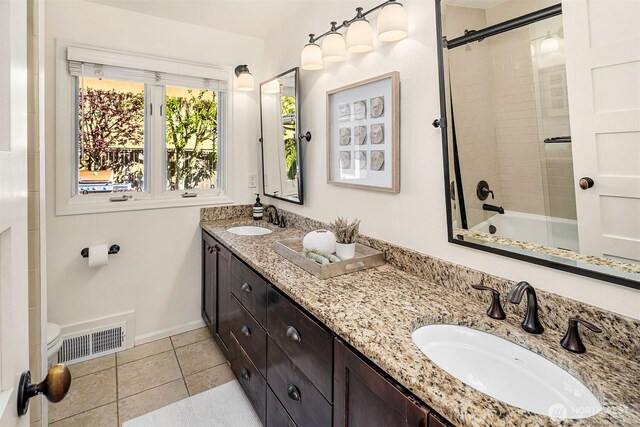 10261 NE 21st Pl, Bellevue, WA 98004 - bathroom featuring double vanity, enclosed tub / shower combo, and tile patterned flooring