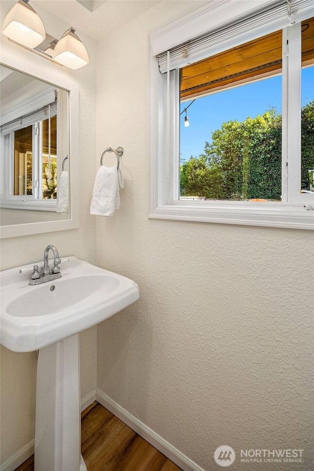 10261 NE 21st Pl, Bellevue, WA 98004 - bathroom with healthy amount of natural light and wood finished floors