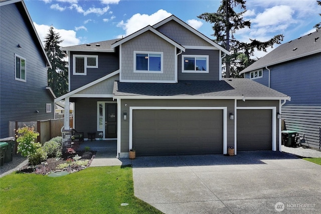 15539 Bergh Ct SE, Yelm, WA 98597 - craftsman inspired home with concrete driveway, covered porch, an attached garage, a front lawn, and a shingled roof