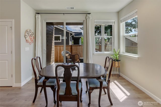 15539 Bergh Ct SE, Yelm, WA 98597 - dining area with baseboards and light wood-style flooring