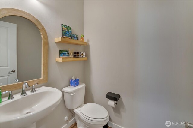 15539 Bergh Ct SE, Yelm, WA 98597 - half bathroom with a sink and toilet