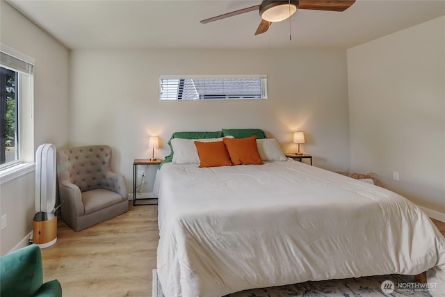 15539 Bergh Ct SE, Yelm, WA 98597 - bedroom featuring multiple windows, wood finished floors, and ceiling fan