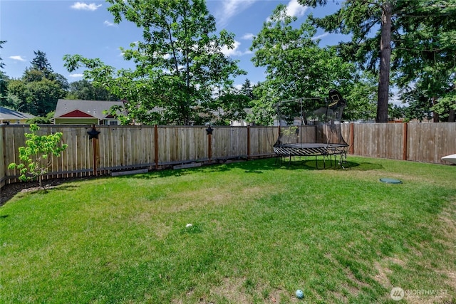 15539 Bergh Ct SE, Yelm, WA 98597 - fenced backyard with a trampoline