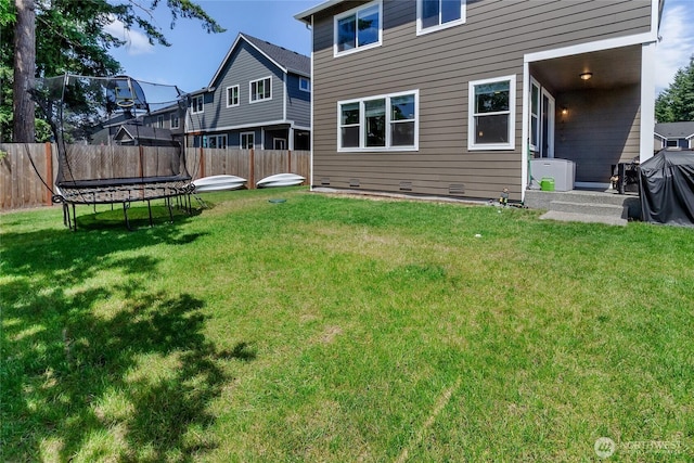 15539 Bergh Ct SE, Yelm, WA 98597 - fenced backyard with a trampoline