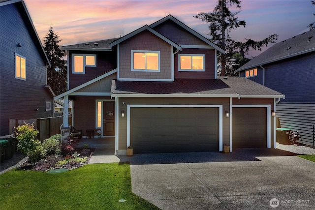 15539 Bergh Ct SE, Yelm, WA 98597 - view of front of house with concrete driveway, a porch, roof with shingles, and a front yard