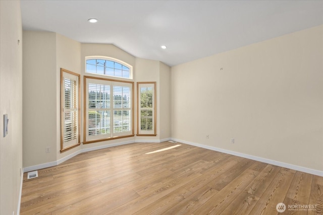8051 283rd St NW, Stanwood, WA 98292 - spare room with light wood finished floors, vaulted ceiling, and recessed lighting