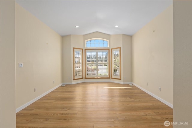 8051 283rd St NW, Stanwood, WA 98292 - empty room with light wood-type flooring and vaulted ceiling