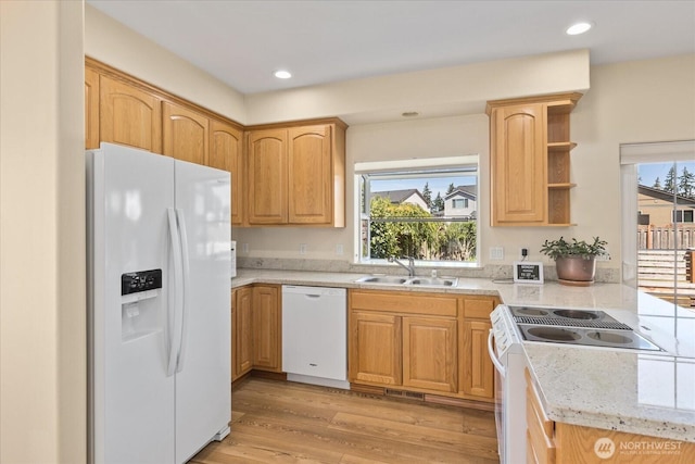 8051 283rd St NW, Stanwood, WA 98292 - kitchen featuring white appliances, light wood-style flooring, recessed lighting, open shelves, and a peninsula