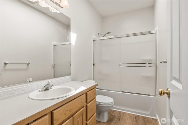 8051 283rd St NW, Stanwood, WA 98292 - full bath with vanity, wood finished floors, and combined bath / shower with glass door