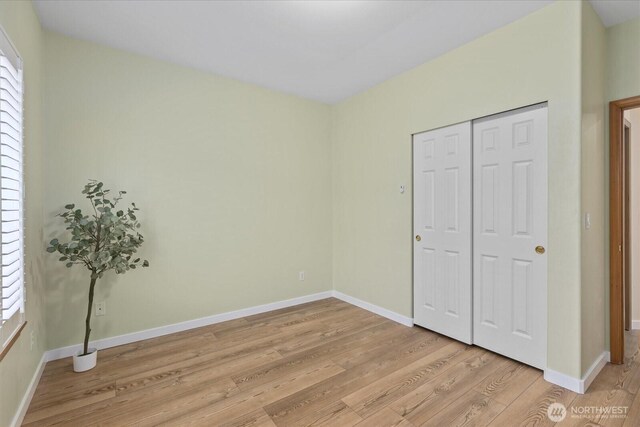 8051 283rd St NW, Stanwood, WA 98292 - unfurnished bedroom with light wood-style flooring and a closet
