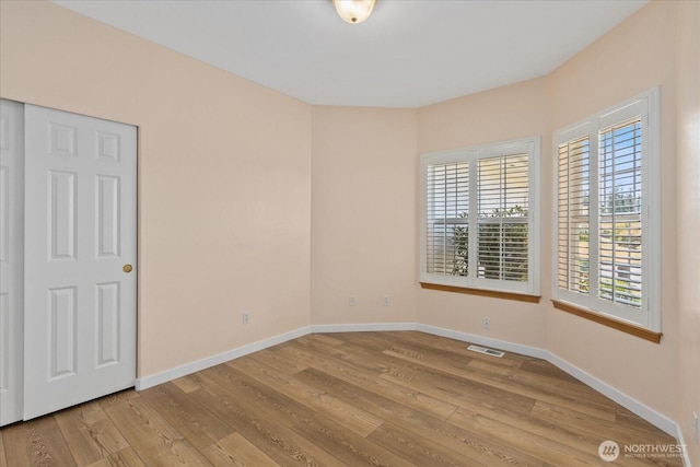8051 283rd St NW, Stanwood, WA 98292 - empty room featuring wood finished floors and baseboards