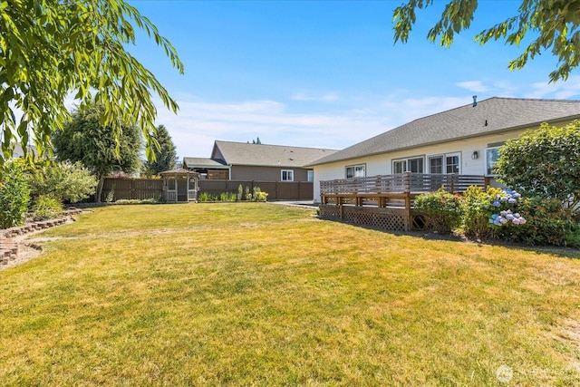 8051 283rd St NW, Stanwood, WA 98292 - fenced backyard featuring a deck