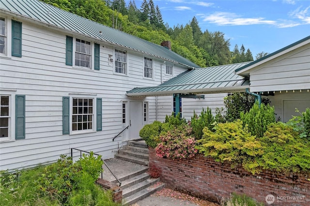 46372 E Main St, Concrete, WA 98237 - view of front of home with a standing seam roof, a metal roof, and entry steps