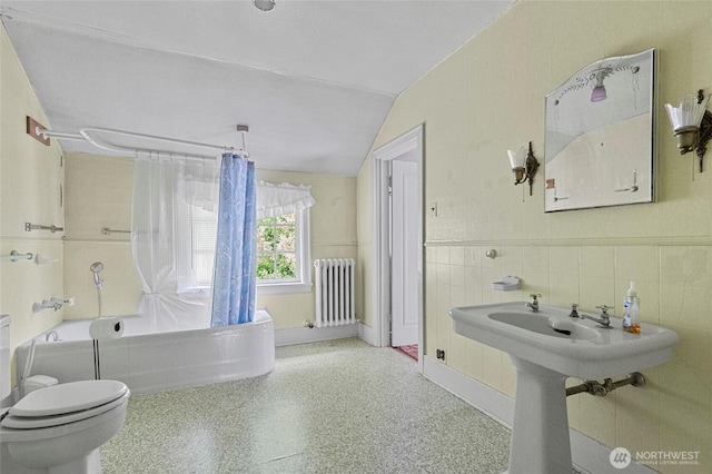 46372 E Main St, Concrete, WA 98237 - full bath featuring radiator heating unit, shower / bathtub combination with curtain, a wainscoted wall, tile walls, and vaulted ceiling