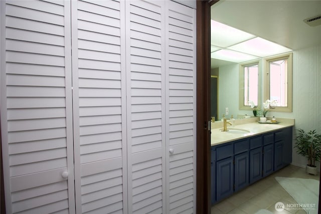 28635 11th Ave S, Federal Way, WA 98003 - bathroom with double vanity, tile patterned flooring, and a closet