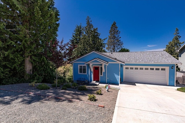 1156 Halsey Ave, Coupeville, WA 98239 - view of front of house featuring a garage, driveway, and a shingled roof