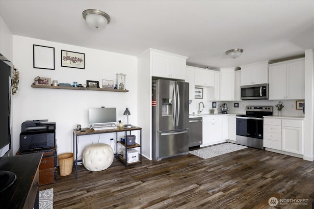 1156 Halsey Ave, Coupeville, WA 98239 - kitchen with appliances with stainless steel finishes, light countertops, dark wood-style floors, and white cabinets