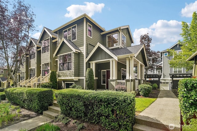 1899 NE Kenyon Ct, Issaquah, WA 98029 - craftsman house with board and batten siding, a porch, and a garage