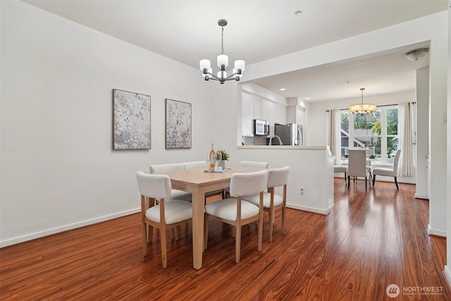 1899 NE Kenyon Ct, Issaquah, WA 98029 - dining room featuring a chandelier and wood finished floors