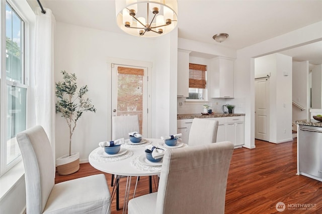 1899 NE Kenyon Ct, Issaquah, WA 98029 - dining room with a chandelier and wood finished floors