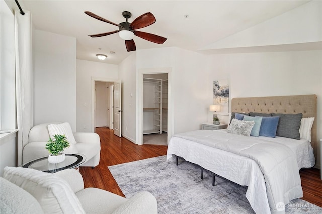 1899 NE Kenyon Ct, Issaquah, WA 98029 - bedroom featuring wood finished floors, a walk in closet, and ceiling fan