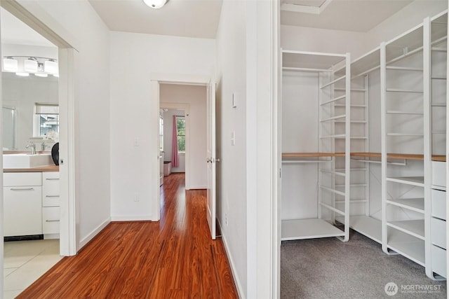 1899 NE Kenyon Ct, Issaquah, WA 98029 - walk in closet with wood finished floors