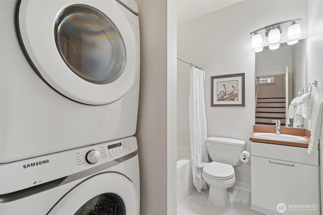 1899 NE Kenyon Ct, Issaquah, WA 98029 - full bathroom featuring estacked washer and dryer, vanity, and shower / bath combo