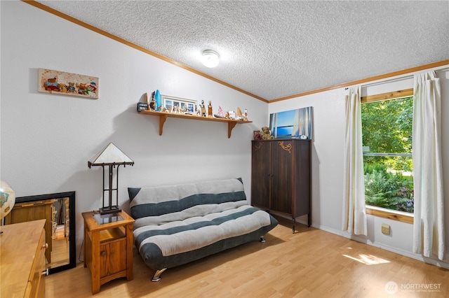 472 Iris Ln, Camano Island, WA 98282 - living area with crown molding, light wood-style floors, and a textured ceiling