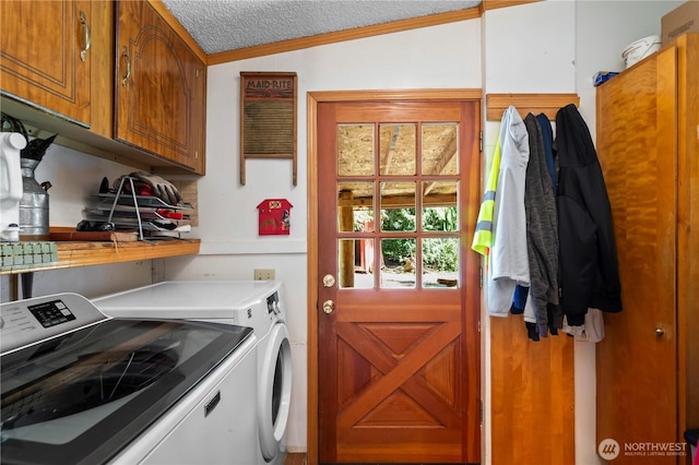 472 Iris Ln, Camano Island, WA 98282 - washroom featuring cabinet space, washing machine and clothes dryer, and crown molding