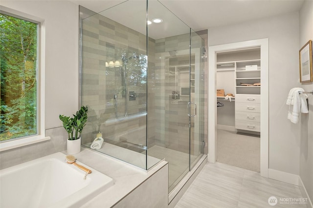 10915 126th Pl NE, Kirkland, WA 98033 - full bath featuring a stall shower, a walk in closet, a garden tub, and recessed lighting