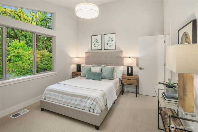 10915 126th Pl NE, Kirkland, WA 98033 - carpeted bedroom with a high ceiling and baseboards