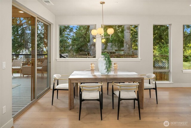 10915 126th Pl NE, Kirkland, WA 98033 - sunroom featuring plenty of natural light and a chandelier