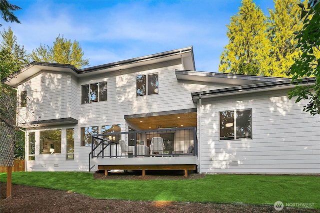 10915 126th Pl NE, Kirkland, WA 98033 - back of property with a wooden deck and a lawn