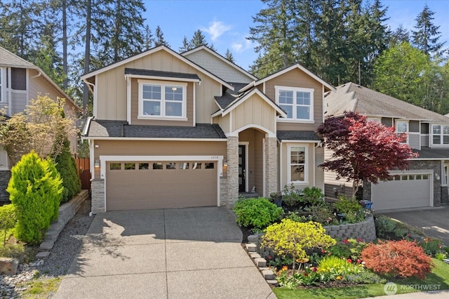 6010 155th St SW, Edmonds, WA 98026 - craftsman-style home with stone siding, driveway, an attached garage, and board and batten siding