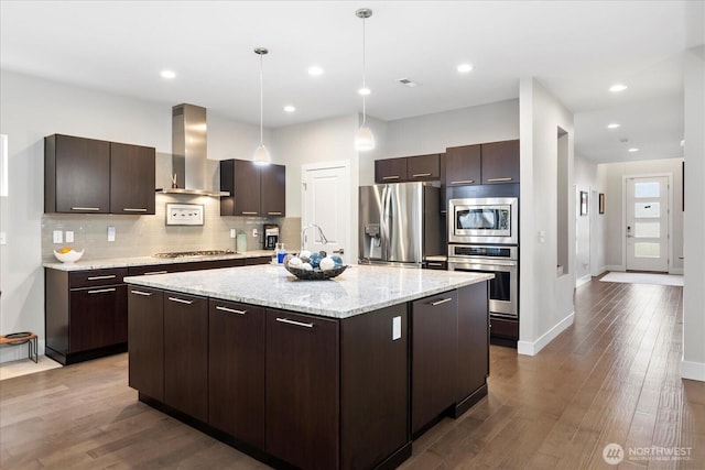 6010 155th St SW, Edmonds, WA 98026 - kitchen with range hood, appliances with stainless steel finishes, decorative backsplash, dark brown cabinets, and wood finished floors