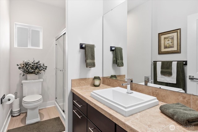 6010 155th St SW, Edmonds, WA 98026 - bathroom featuring vanity, a stall shower, and wood finished floors