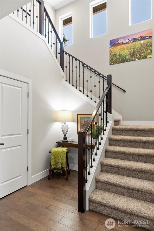 6010 155th St SW, Edmonds, WA 98026 - stairs featuring a towering ceiling and hardwood / wood-style flooring