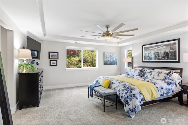 6010 155th St SW, Edmonds, WA 98026 - bedroom with a raised ceiling, light carpet, and a ceiling fan