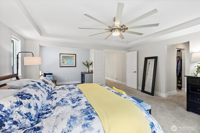 6010 155th St SW, Edmonds, WA 98026 - bedroom with a tray ceiling, light carpet, a spacious closet, and ceiling fan