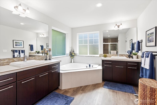 6010 155th St SW, Edmonds, WA 98026 - full bathroom featuring a shower stall, two vanities, wood finished floors, a bath, and recessed lighting