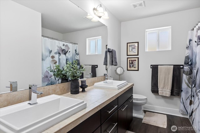 6010 155th St SW, Edmonds, WA 98026 - full bathroom featuring double vanity, wood finished floors, and a shower with curtain