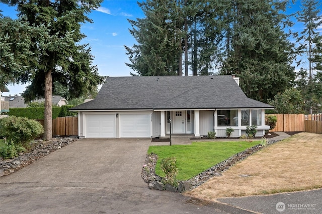 1308 133rd St S, Tacoma, WA 98444 - view of front of home with an attached garage, driveway, and a shingled roof