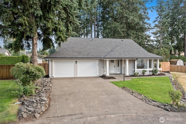 1308 133rd St S, Tacoma, WA 98444 - view of front of home featuring concrete driveway, an attached garage, and roof with shingles