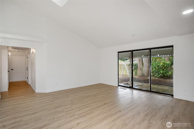 1308 133rd St S, Tacoma, WA 98444 - empty room featuring light wood-style flooring and high vaulted ceiling