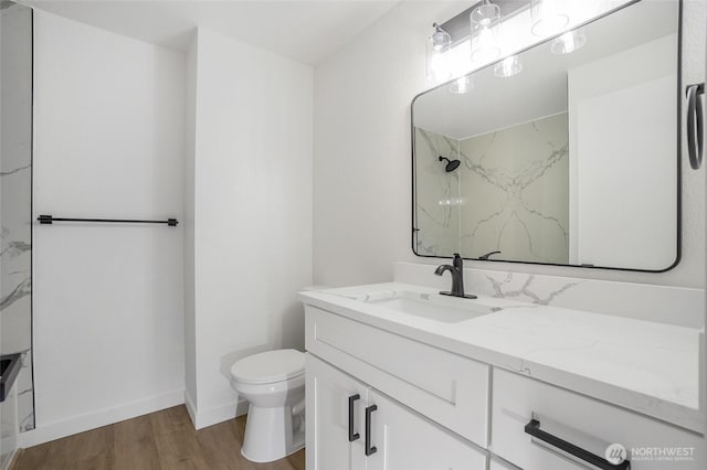 1308 133rd St S, Tacoma, WA 98444 - full bathroom with wood finished floors, a marble finish shower, and vanity