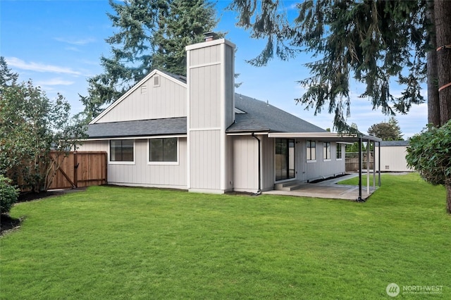 1308 133rd St S, Tacoma, WA 98444 - rear view of house with a shingled roof, a patio area, and a chimney