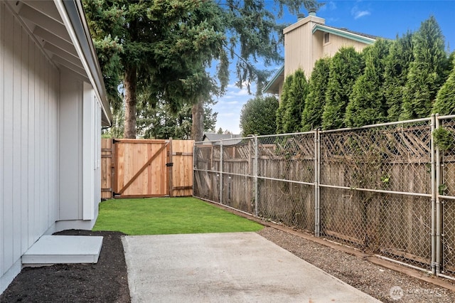 1308 133rd St S, Tacoma, WA 98444 - fenced backyard featuring a patio area and a gate