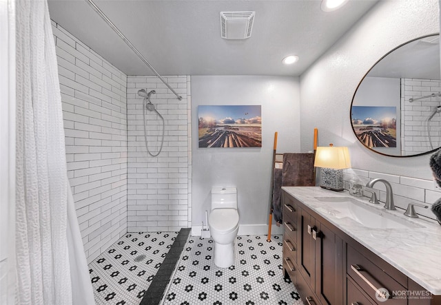6008 S Bakerview Park Dr, Ferndale, WA 98248 - bathroom featuring vanity, tiled shower, and recessed lighting