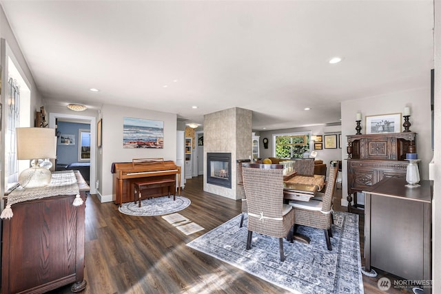6008 S Bakerview Park Dr, Ferndale, WA 98248 - dining area with a multi sided fireplace, dark wood-type flooring, and recessed lighting